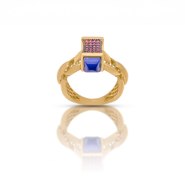 Gold ring with a blue gemstone on a white background